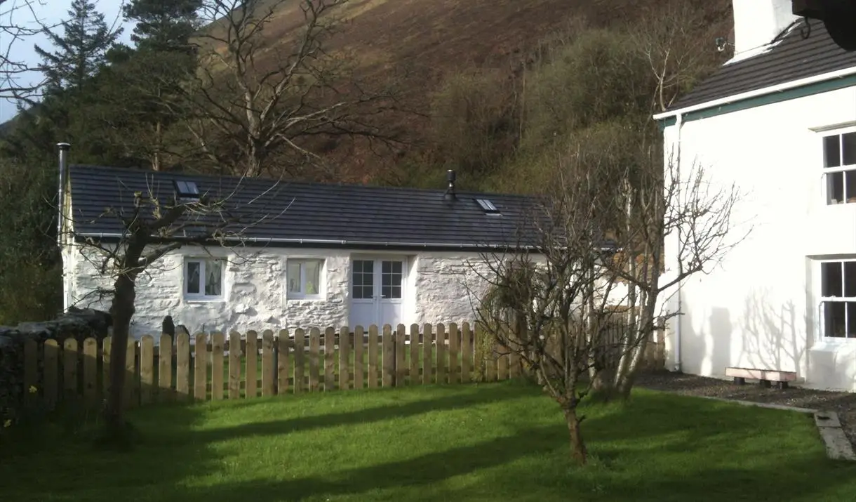 Front of Glen Mooar Cottage with rolling Sulby Glen hills in the background