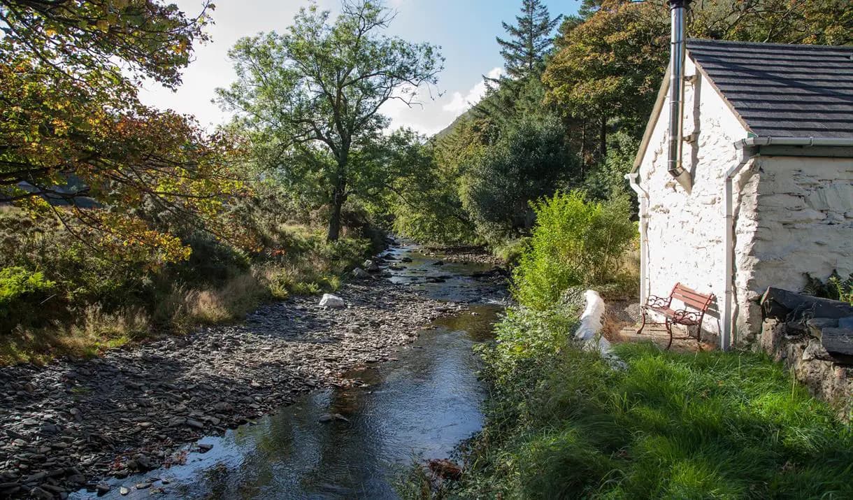 Sulby River flowing past Glen Mooar Cottage in summer